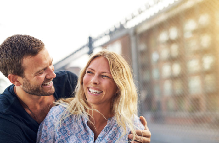 Happy vivacious couple enjoying a good joke